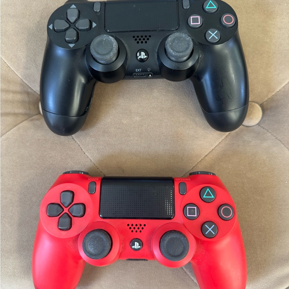 Sony PlayStation Controllers - Black and Red